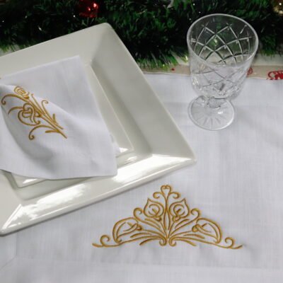 Luxury Embroidered Linen Placemat Set with golden embroidery napkin and wooden ring on festive table